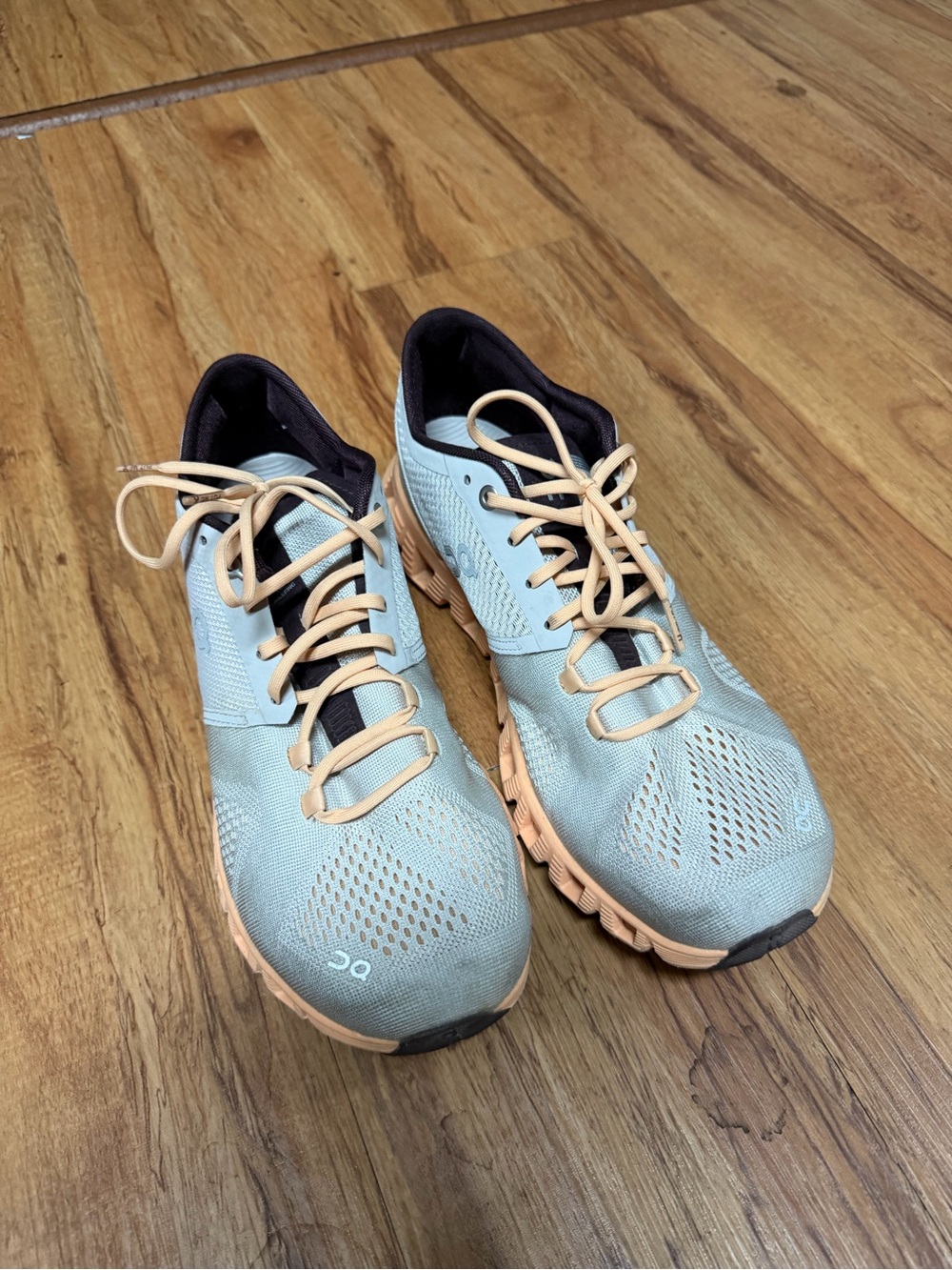 On Running Women’s Light Blue Running Shoes with Peach Accents